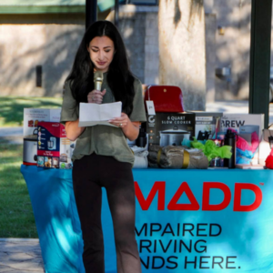 Olivia Hayes speaks to the crowd about her husband, Wesley, at the MADD Louisiana Walk in Baton Rouge.